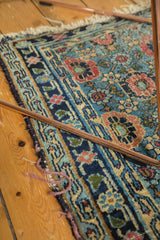Worn dark indigo side binding and tattered fringe on this antique Persian Lilihan rug.