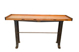 Industrial work table counter with a light brown wood top and dark reclaimed iron base.