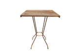 Reclaimed square wood side table featuring a weathered top and an X-shaped rusted metal base.