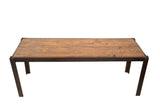 Reclaimed Industrial Bench Table, brown wood top with dark metal frame.