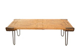Reclaimed industrial coffee table with rustic wood top patina and black hairpin legs.