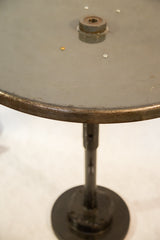 Reclaimed industrial metal edge and dark green surface of the bistro table top.