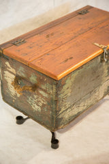Bottom industrial leg and distressed green paint on the reclaimed trunk.