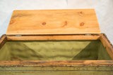 Vintage industrial factory cart with open wooden lid revealing distressed light green interior.