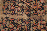 Worn pile revealing natural foundation on vintage Hamadan rug, with navy boteh motif and tattered fringe.