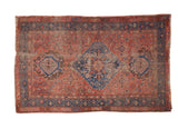 Antique Persian Hamadan rug, distressed terracotta field with navy diamond medallion.