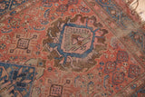 Textured antique Hamadan rug with hard distress, pinwheel and floral motifs in blush, bronze, sky blue.