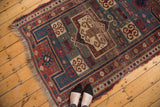Antique Fachralo Kazak rug's geometric medallion with rams horn motifs and rich patina.
