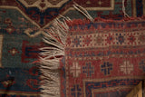 Fringe and historic wear on brick red, blue-green, and beige Fachralo Kazak rug.
