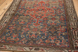 Distressed vintage Hamadan rug showing sky blue, tangerine Herati motif and Mir Serbend border.