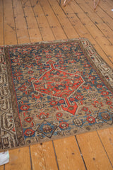 Vintage Hamadan rug fragment with tangerine diamond motif, sky blue Herati, and Mir Serbend border on beige.