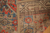 Hamadan rug fragment edge showcasing fabric binding, distressed pile, and backing weave.