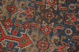 Detailed texture of hand-knotted Herati motif, showing even distress in blue, orange, beige.