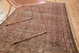 Antique Malayer rug detail: Herati design with birds, time-softened blush, charcoal pile.