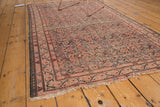 Antique Malayer rug with allover Herati pattern, showing hard even distress and tattered ends.