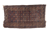 Vintage Belouch rug, allover crab design lattice in dark indigo, brown, ivory, with distressed pile.