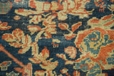 Mustafi Mahal rug texture: cobalt blue, terra cotta floral motifs with even pile wear.