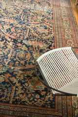 Mustafi design on antique Mahal carpet: animal figurines, scrolling vines, rich blue, terra cotta.