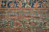 Antique Mustafi Mahal: intricate floral patterns, cobalt, terra cotta, beige, and exposed foundation.