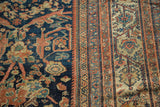 Antique Mustafi Mahal rug's deep blue scrolling florals and intricate terra cotta borders.