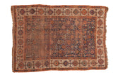 Antique Kamseh rug, indigo ground, allover animal and plant motifs, madder red border, storied patina.