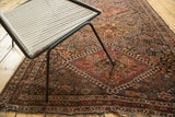 Antique Fine Qashqai rug with madder red, indigo blue, and gold allover tribal patterns.