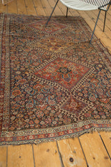 Antique Qashqai rug border and field, revealing intricate motifs and even wear.