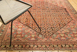 Antique Malayer rug corner showing blush and indigo Herati motif, even wear to knot heads.