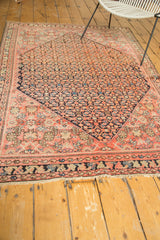 Antique Malayer rug with blush and indigo Herati pattern, showing even wear to knot heads.