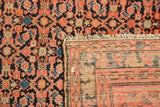 Antique Malayer rug detail: evenly worn Herati pile, hand-knotted foundation, and fringed end.