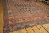 Antique Afshar carpet corner with tattered kilim end and tribal geometric borders.