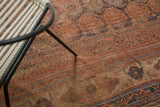 Hard distressed tribal patterns in madder red and blue on an antique Afshar carpet.
