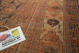 Antique Afshar carpet's distressed pile with oversized tribal paisley boteh in rust and blue.