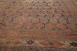 Distressed madder red and navy pile showcasing oversized boteh and tribal border patterns.