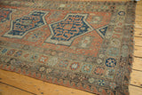 Tattered edge, geometric border, and rectilinear medallion of Antique Soumac Carpet.