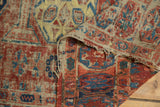 Detail of hand-woven antique Soumac flatweave rug, showing fringed edges and geometric patterns.