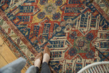 Antique Persian Soumac runner featuring geometric eagle motifs in brilliant gem tones.