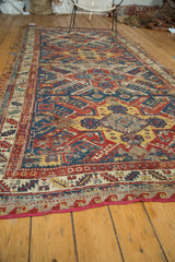 Red-bound side edge and geometric border with visible foundation on the antique Soumac.