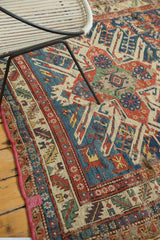 Vivid geometric eagle motifs on an antique Persian Soumac rug, showcasing hand-woven texture and rich patina.