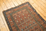Detail of antique Hamadan runner: terra cotta, teal germinating flower pattern with mostly even wear.