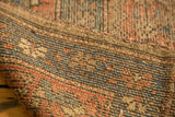 Antique Hamadan rug's knot heads and exposed foundation texture with blue, terra cotta threads.