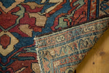 Vintage Lilihan rug close-up: hand-knotted backing, colorful floral pile, mostly secure edge.