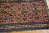 Antique Lilihan rug, dusty rose field with navy trefoil and quatrefoil motifs, bold geometric border.