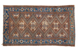 Vintage Hamadan rug, Caucasian style, with bold bronze, sand, and blue geometric diamond pattern.