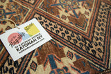 Bold Caucasian geometric pattern on vintage Hamadan rug with earthen bronze and watery blue tones.