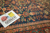 Antique Fereghan rug with detailed floral trellis in indigo, madder red, and pale rose.
