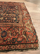 Classic Samovar border and tattered side on antique Fereghan rug with madder and indigo tones.