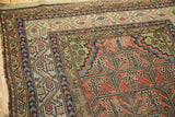 Vintage Malayer rug detail: Mir Serbend border, animal motifs, blush, green, and blue.