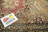Elaborate germinating flower motif and scrolling rococo minor border on a classic antique Isfahan rug.