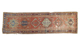 Antique Karaja runner with brick red field, geometric medallions, and mellowed hues, 3x10'7